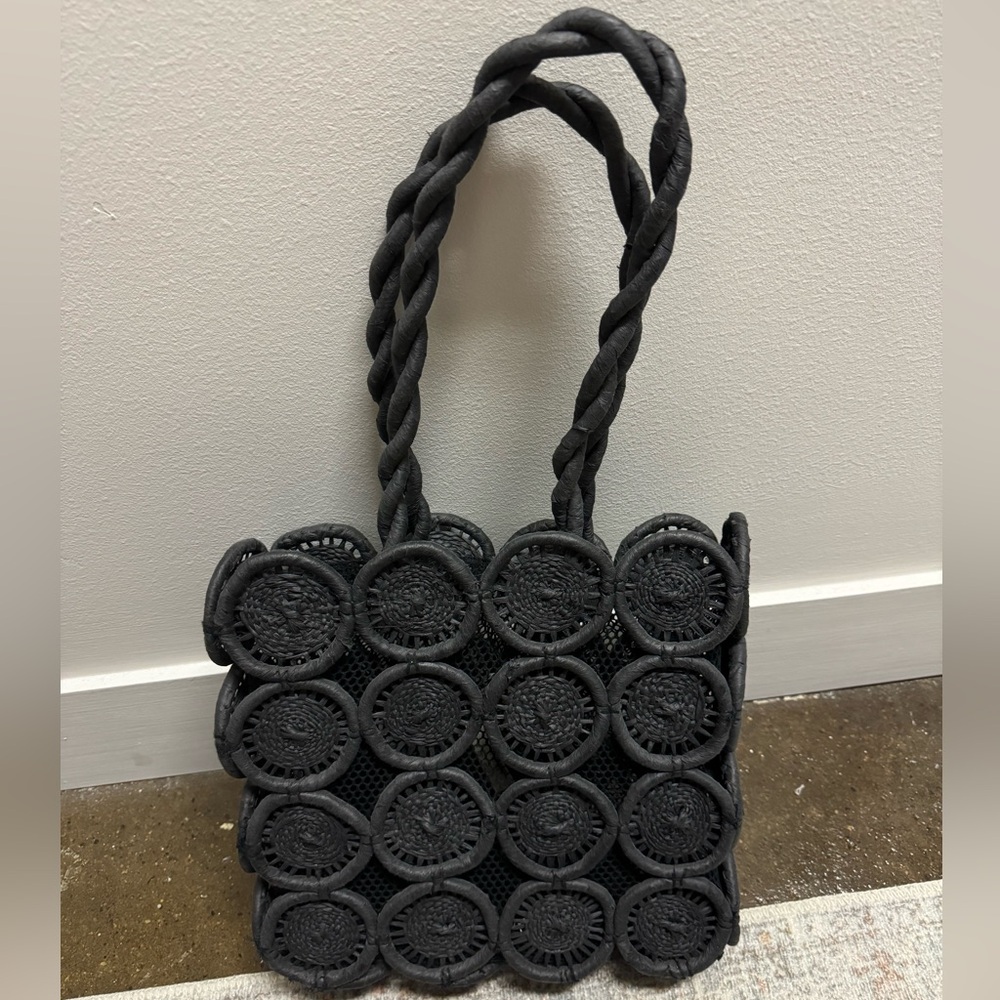 Madewell straw bag in black.